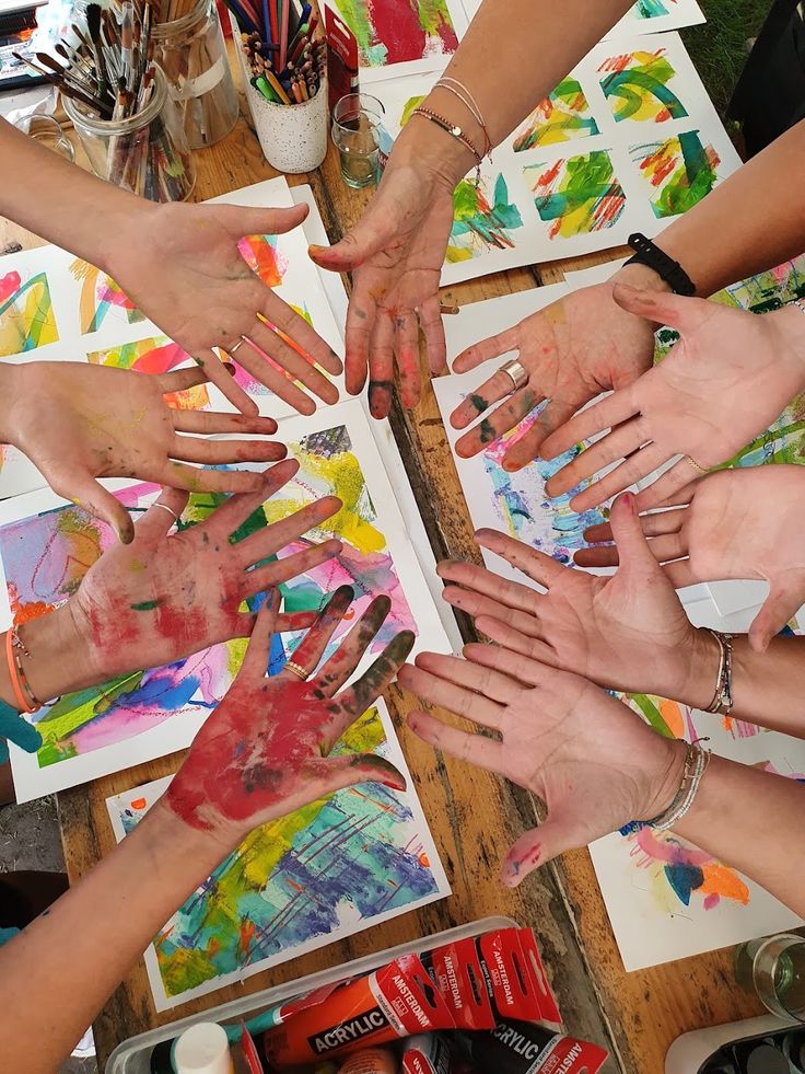 People creating colorful artwork at an art workshop in Kolkata